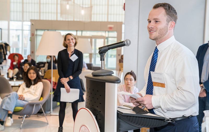 Young person at a podium receiving an award